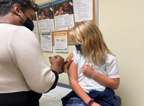 Child receiving immunization at DOH-Duval Health Center. 