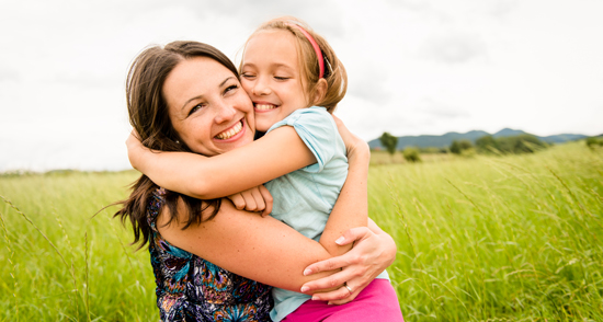 Mom Hugging Daughter