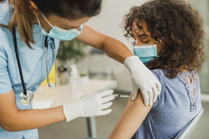 Nurse Gives Teen Girl COVID-19 Vaccine 
