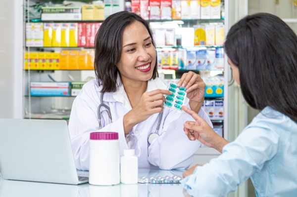 Pharmacist talking to client.