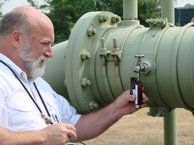 Water systems professional next to system