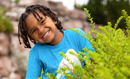 Boy standing outside smiling
