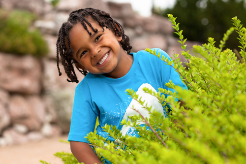 Boy standing outside smiling