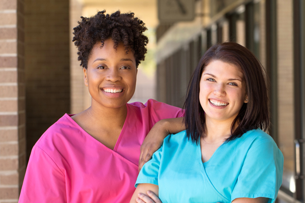 two nurses smiling