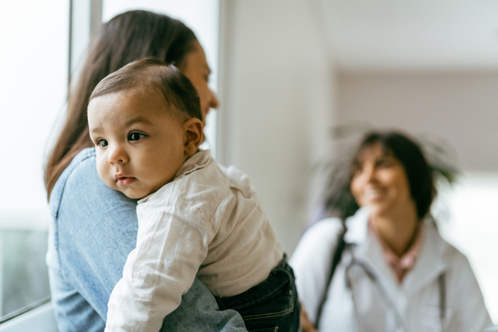 mother holding a baby