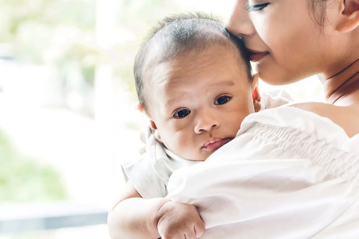 close-up photo of mom holding baby
